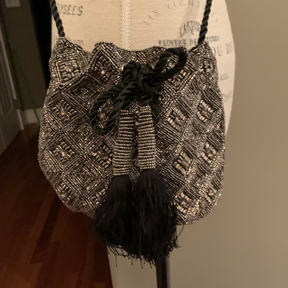 Beaded and jeweled bag with ties Long strap/cord.
Great bag Very decorative - Picture 2 of 6